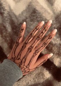 100 Stunning Skeleton Hand Tattoos Meanings Tattoo Me Now
