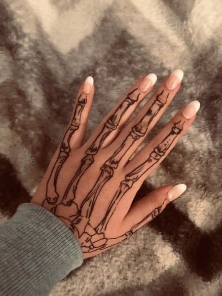 20 Cool Skeleton Hand Tattoo Ideas Meaning