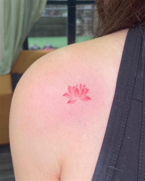 A Woman Amp 39 S Back Shoulder With A Pink Lotus Tattoo On It