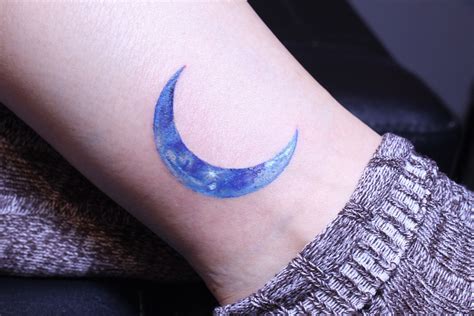 Blue Spectrum Moon Tattoo On The Left Hand Blue Spectrum Moon Tattoo On The Left Hand