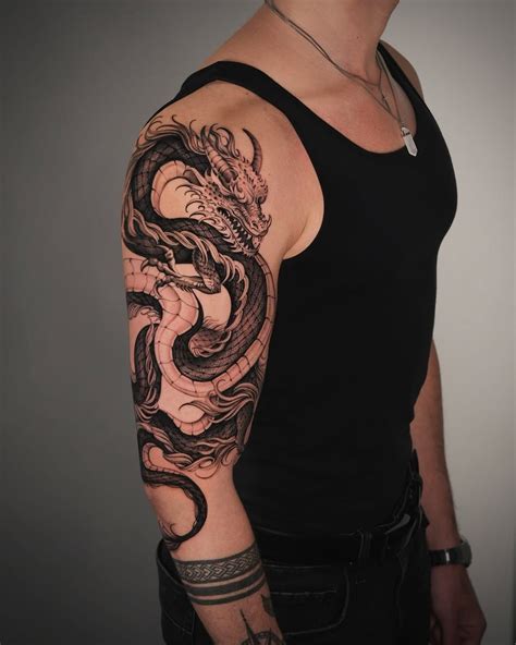 Bold Dragon Tattoo Design For Arm Art Lovers In 2025 Dragon Tattoo Arm Dragon Tattoos For Men