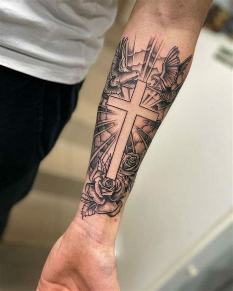 Cross Tattoo Photo 113 Cross Tattoos Embracing Wrist Beauty 8211 A Timeless Tapestry Cross Tattoo Designs Cross Tattoo For Men Cross Tattoo