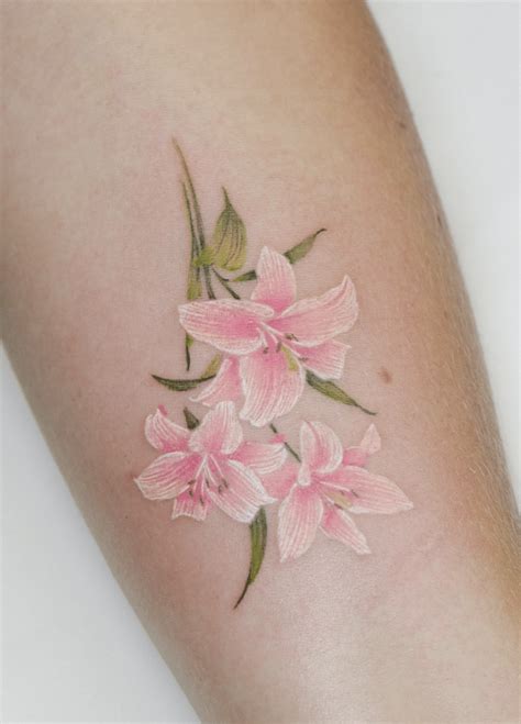 Elegant Lily Flower Tattoo Beauty Growth And Strength Soft Graceful And Full Of Meaning This Beautiful Lily Tattoo Captures The Essence Of Purity Resilience And Transformation Each Delicate Petal And Flowing