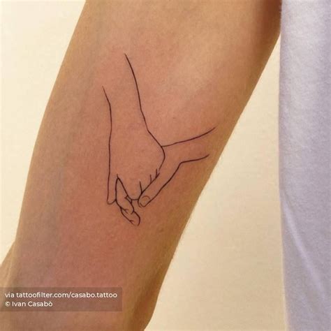 Fine Line Holding Hands Tattoo Hand Holding Tattoo Hand Tattoos Fine Line Tattoos