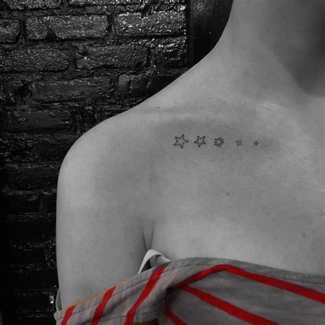 Five Little Stars Tattooed On The Collarbone