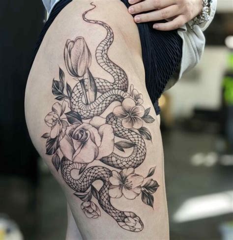 Illustrative Black Ink Snake Tattoo On A Thigh And Hip On Craiyon Illustrative Black Ink Snake Tattoo On A Thigh And Hip On Craiyon