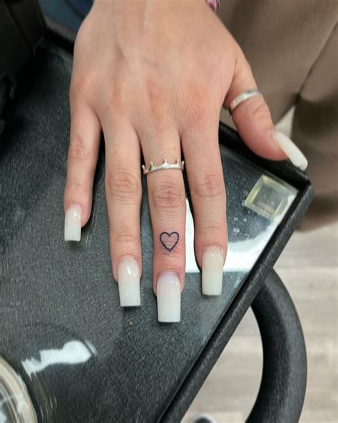 Pin By Melissa Eakle On Tattoos Heart Tattoo On Finger Heart Tattoo Ace Tattoo