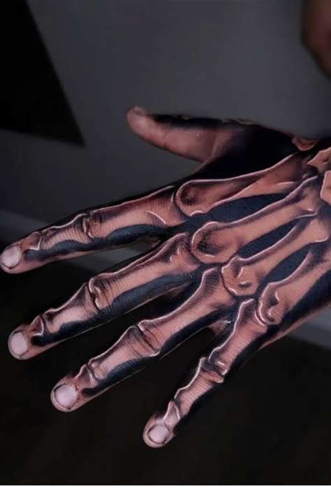 Skeleton Hand Tattoo Ideas With 50 Tattoo Examples Tattoo Stylist
