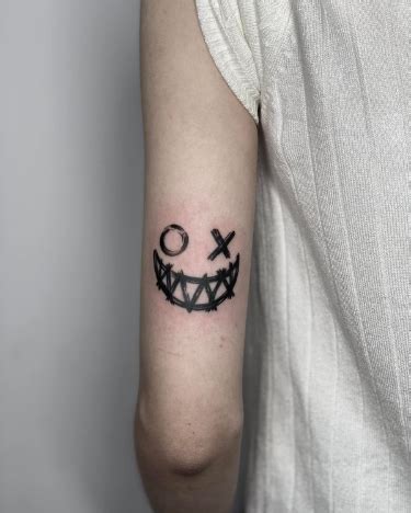 Unique Elbow Tattoo Distinctive Joker Smile Ink Above The Elbow