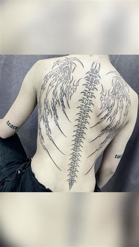 Upper Back Tattoos For Women Wings Swords Cyber Tribal Servingsomelines