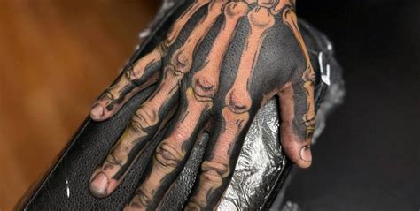 What S The Controversy Around Bone Hand Tattoos R Tattoodesigns
